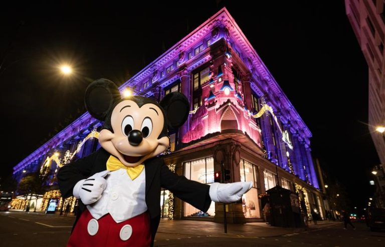 Mickey Mouse in front of Disney & Selfridges’ A Most Magical Christmas.