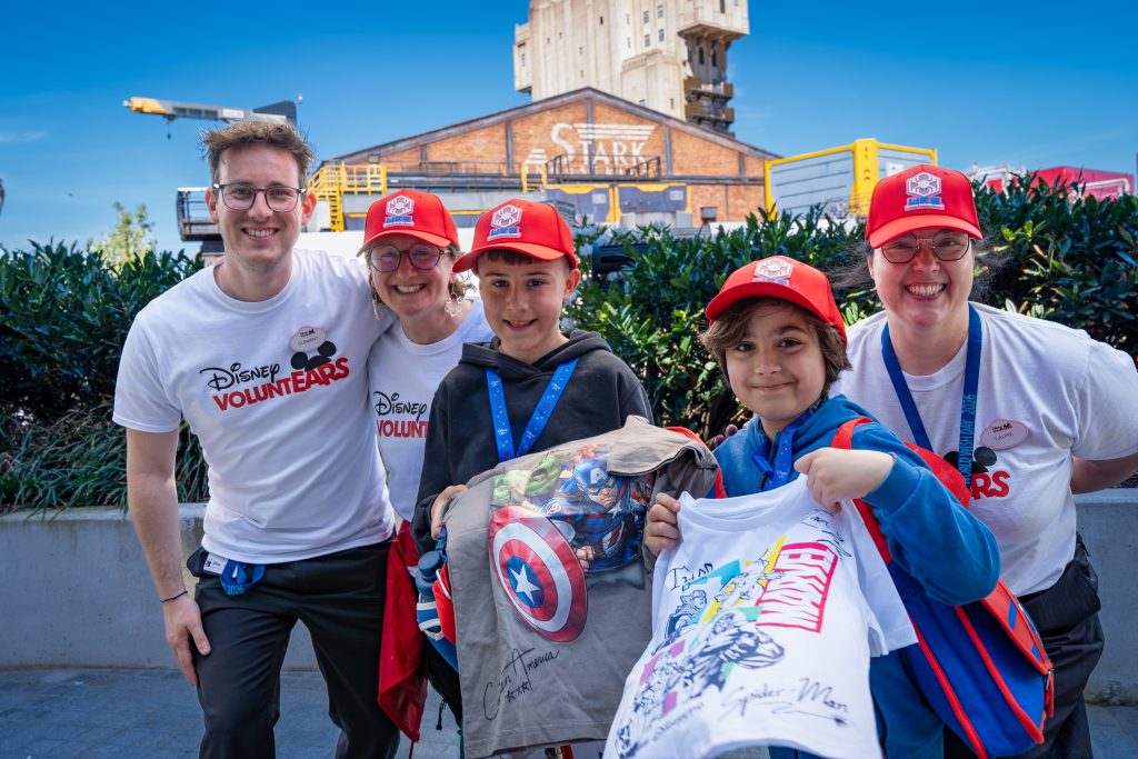 Disney VoluntEARs at a Marvel event with children