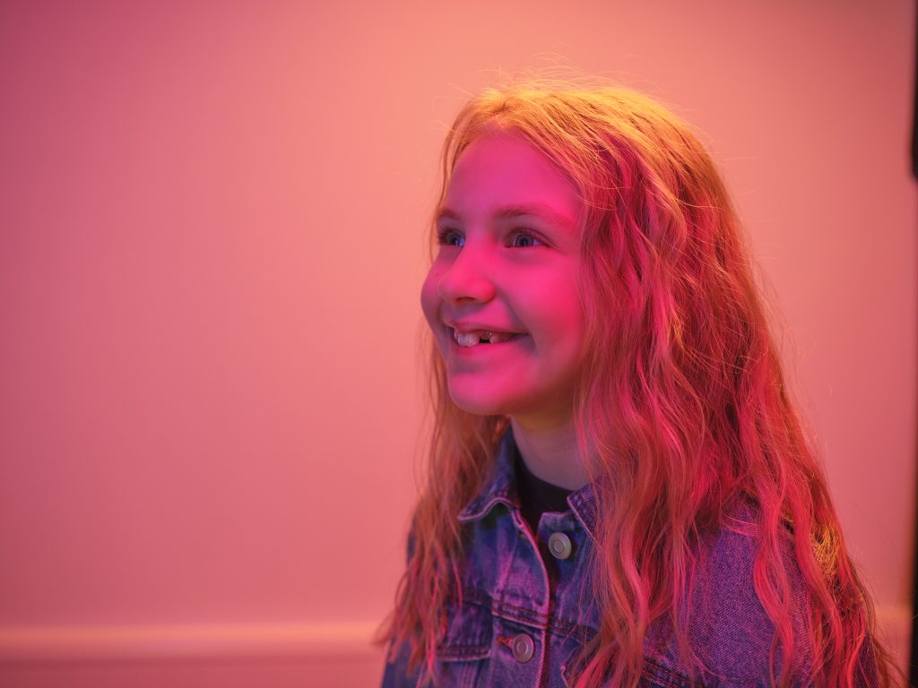 Child in pink light