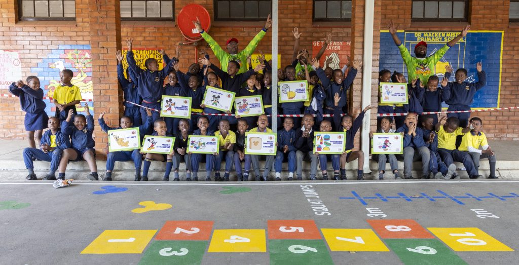 Schoolchildren and adults at a Sporting Chance event in South Africa