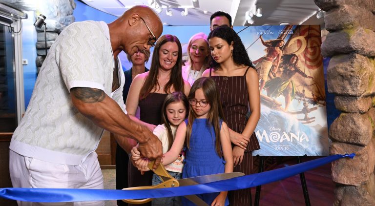 Dwayne Johnson with children opening the new Moana section of the Disney Reef at GOSH